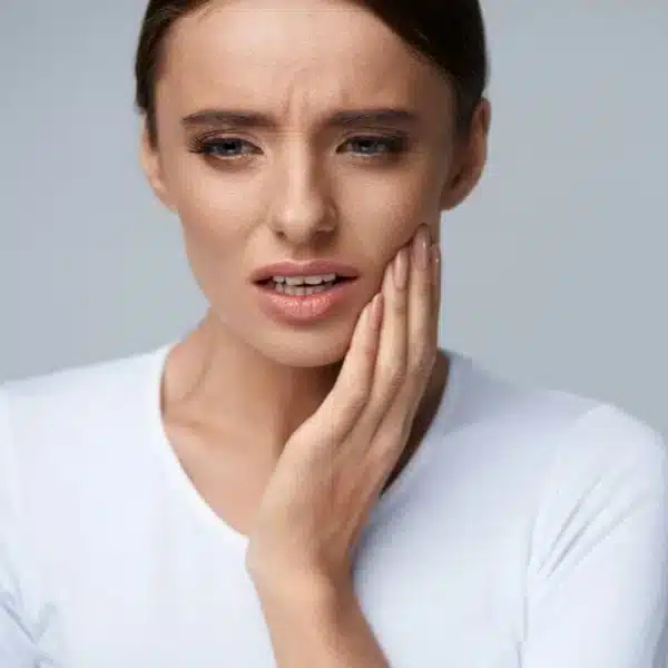 A woman with a jaw pain